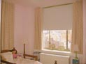 Room darkening roller shades and ripple fold drapes for childrens bedroom in upper east side, Manhattan