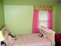 Wood blinds, cornice and sheer drapes in childrens bedroom in Westchester, New York